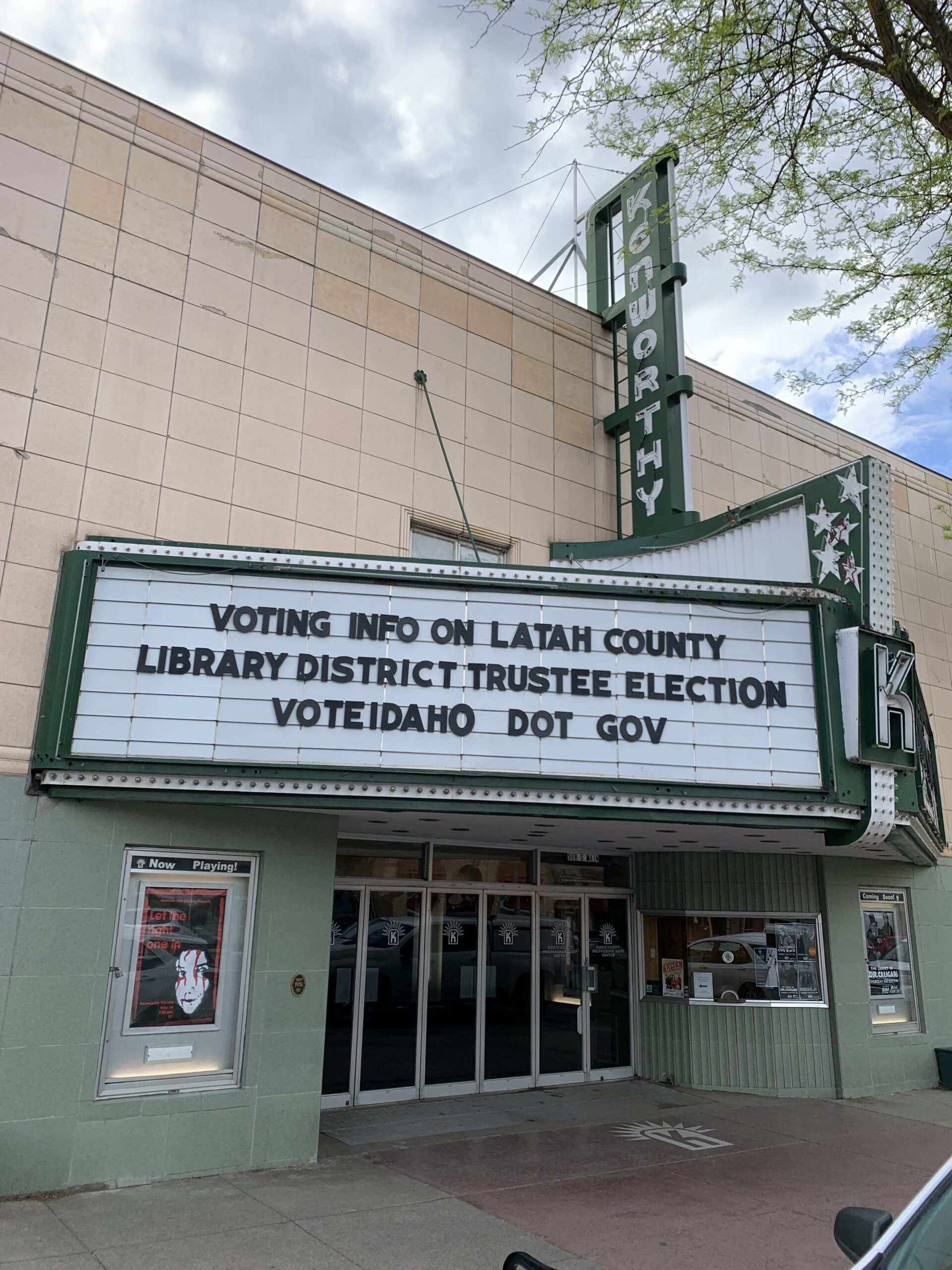 Old theatre marquee advertising local library election information